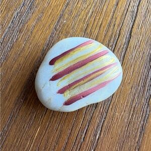 Decorative Handpainted Rock with Red and Gold Stripes